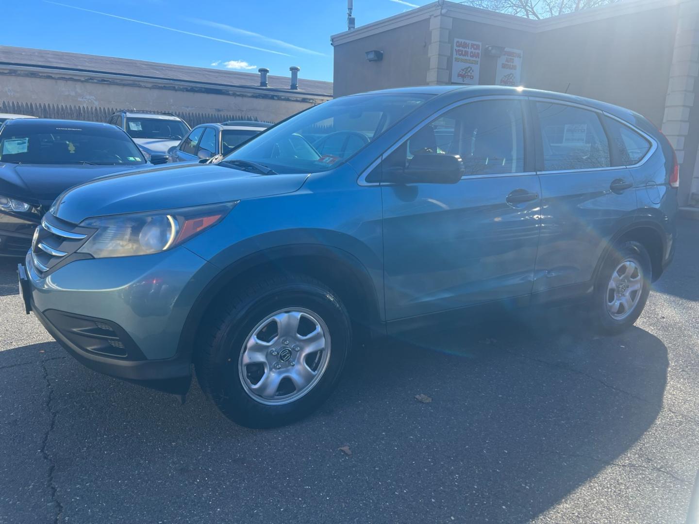 2013 Teal /Gray Honda CR-V LX 4WD 5 Speed AT (5J6RM4H33DL) with an 2.4L L4 DOHC 16V engine, 5 Speed Automatic transmission, located at 1018 Brunswick Ave, Trenton, NJ, 08638, (609) 989-0900, 40.240086, -74.748085 - Photo#0